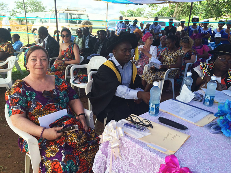 Mrs. Amelia Guilerra, supporting the students who have performed well with awards of computer and others.